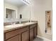 Double vanity bathroom with granite countertops and modern fixtures at 1927 Partin Terrace Rd, Kissimmee, FL 34744
