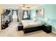 Large Primary bedroom with a king bed and calming blue walls at 1927 Partin Terrace Rd, Kissimmee, FL 34744