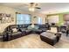 Spacious living room with sectional sofa and large windows at 1927 Partin Terrace Rd, Kissimmee, FL 34744