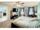 Spacious bedroom with large bed, TV, and ensuite bathroom access at 1927 Partin Terrace Rd, Kissimmee, FL 34744
