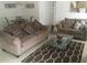 Spacious living room featuring comfortable sofas and a stylish coffee table at 236 Paradise Woods Ct, Davenport, FL 33896