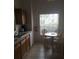 Cozy kitchen with breakfast nook and view of backyard at 236 Paradise Woods Ct, Davenport, FL 33896