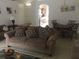 Bright living room with view into kitchen and dining area at 236 Paradise Woods Ct, Davenport, FL 33896