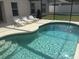 Inviting kidney-shaped pool with surrounding patio at 236 Paradise Woods Ct, Davenport, FL 33896