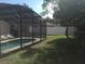 Inviting pool area with screened enclosure and lounge chairs at 236 Paradise Woods Ct, Davenport, FL 33896