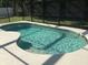 Relaxing kidney shaped pool with screened enclosure at 236 Paradise Woods Ct, Davenport, FL 33896