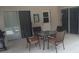 Patio with table and chairs, adjacent to pool at 236 Paradise Woods Ct, Davenport, FL 33896