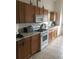 Well-equipped kitchen with ample cabinetry and modern appliances at 236 Paradise Woods Ct, Davenport, FL 33896