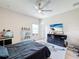 Bright bedroom with a large bed, TV, and plenty of storage at 2605 Yountville Ave, Kissimmee, FL 34741