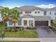 Two-story house with gray roof and white siding at 2605 Yountville Ave, Kissimmee, FL 34741
