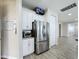 Kitchen with stainless steel refrigerator and white cabinets at 2605 Yountville Ave, Kissimmee, FL 34741