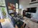 Relaxing living room with a sectional sofa and large TV at 325 Sonoma Valley Cir, Orlando, FL 32835