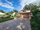 Two-story house with a brown garage door and landscaped yard at 325 Sonoma Valley Cir, Orlando, FL 32835