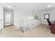 Spacious loft area with a built-in workspace and bathroom access at 331 Bridgewater Dr, Davenport, FL 33897