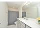 Clean bathroom with a shower/tub combo, vanity, and white quartz countertop at 4963 Royal Point Ave, Kissimmee, FL 34746