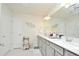 Double vanity bathroom with a large mirror and plenty of counter space at 4963 Royal Point Ave, Kissimmee, FL 34746