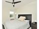 Cozy bedroom with a ceiling fan and window views at 4963 Royal Point Ave, Kissimmee, FL 34746