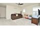 Bright bonus room, featuring a couch and window seating at 4963 Royal Point Ave, Kissimmee, FL 34746