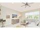 Living room with gray sectional sofa and large window offering natural light at 4963 Royal Point Ave, Kissimmee, FL 34746