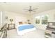 Bright main bedroom with a comfortable bed and sitting area at 4963 Royal Point Ave, Kissimmee, FL 34746
