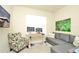 Comfortable office space featuring a desk, seating, and large wall art at 4963 Royal Point Ave, Kissimmee, FL 34746