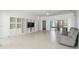 Spacious living room with ample natural light and comfy seating at 540 Genoa Dr, Poinciana, FL 34759