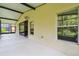 Extended screened patio with sliding glass doors and outdoor views at 540 Genoa Dr, Poinciana, FL 34759
