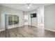Bright bedroom with wood-look floors and access to a private patio at 540 Genoa Dr, Poinciana, FL 34759