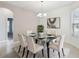 Formal dining room featuring a glass table and six chairs at 540 Genoa Dr, Poinciana, FL 34759