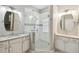 Modern bathroom with a large walk-in shower and double vanity at 540 Genoa Dr, Poinciana, FL 34759