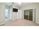 Spacious bedroom with mirrored closet and access to bathroom at 540 Genoa Dr, Poinciana, FL 34759