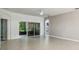Open concept living room with tile floors and access to backyard at 540 Genoa Dr, Poinciana, FL 34759