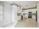 Modern kitchen with white shaker cabinets and stainless steel appliances at 540 Genoa Dr, Poinciana, FL 34759