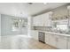 Modern kitchen with white shaker cabinets and stainless steel appliances at 540 Genoa Dr, Poinciana, FL 34759
