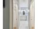 Elegant bathroom with marble flooring, a walk-in shower, and double vanity at 540 Genoa Dr, Poinciana, FL 34759