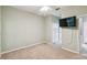 Well-lit bedroom with large closet and wall-mounted TV at 540 Genoa Dr, Poinciana, FL 34759