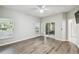Spacious bedroom featuring wood-look floors and sliding glass doors at 540 Genoa Dr, Poinciana, FL 34759