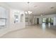 Bright and airy living room with tile floors and views to backyard at 540 Genoa Dr, Poinciana, FL 34759