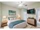Bright bedroom featuring a queen bed and stylish dresser at 540 Genoa Dr, Poinciana, FL 34759