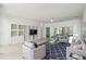 Living room with built-in shelving and comfortable seating area at 540 Genoa Dr, Poinciana, FL 34759