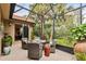 Enjoyable screened patio with comfortable seating and outdoor planters at 561 Sienna Dr, Poinciana, FL 34759