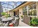 Peaceful screened patio with seating area and beautiful views at 561 Sienna Dr, Poinciana, FL 34759