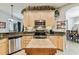 Kitchen boasts granite countertops, stainless steel appliances, and light wood cabinets at 561 Sienna Dr, Poinciana, FL 34759
