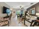 Bright living room with tiled floors, comfy seating and access to backyard at 561 Sienna Dr, Poinciana, FL 34759