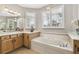 Relaxing bathroom with soaking tub, shower, and updated vanity at 561 Sienna Dr, Poinciana, FL 34759