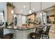 Eat-in kitchen with granite countertops, breakfast bar, and stainless steel appliances at 561 Sienna Dr, Poinciana, FL 34759