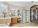 Spa-like bathroom featuring a walk-in shower and dual sinks at 561 Sienna Dr, Poinciana, FL 34759