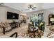 Open living room with a view of the kitchen and backyard access at 561 Sienna Dr, Poinciana, FL 34759