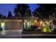 Evening view of house exterior with landscaping and lighting at 561 Sienna Dr, Poinciana, FL 34759