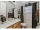 Clean bathroom with tub shower combo and updated vanity at 561 Sienna Dr, Poinciana, FL 34759